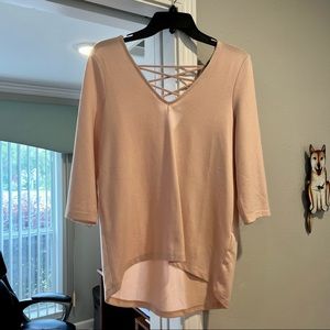 Pink v neck sweater with open criss cross back